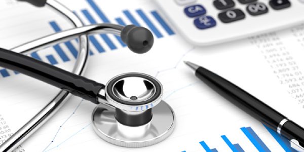 Stethoscope with financial statement — healthcare impact